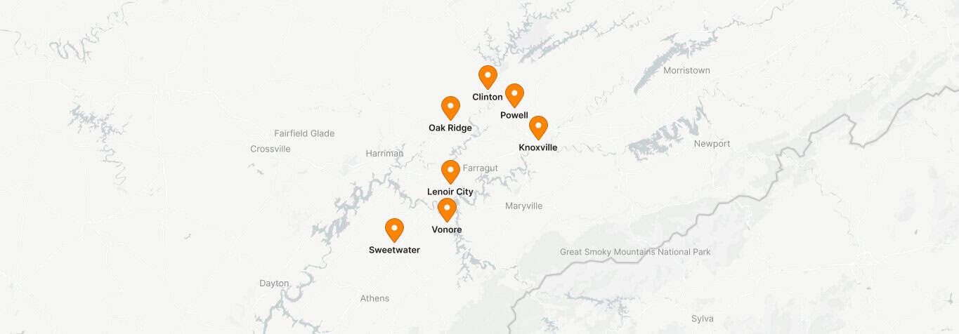 A map displaying marked locations in Tennessee, including Clinton, Powell, Knoxville, Oak Ridge, Lenoir City, Vonore, and Sweetwater. The Great Smoky Mountains National Park is visible to the southeast. Notable services such as commercial locksmith and key cutting are available throughout these areas.